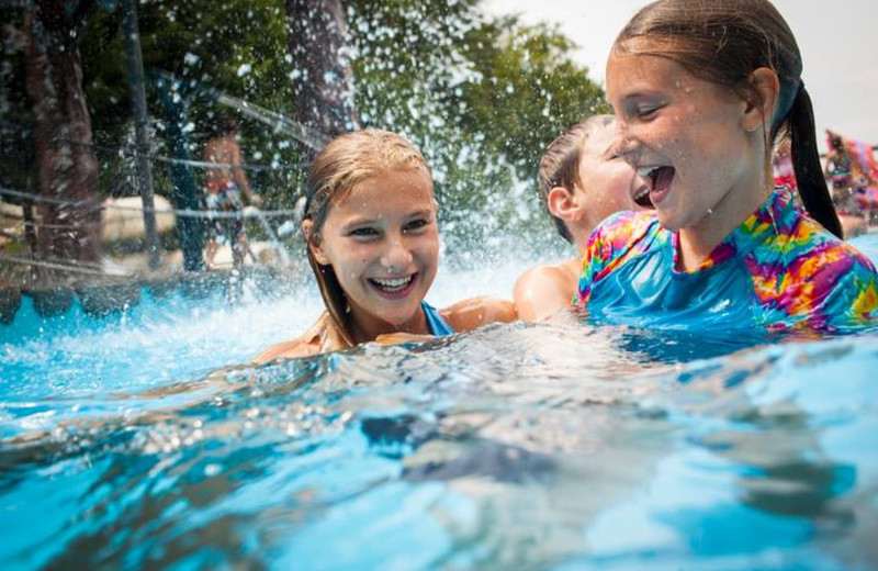 Family swimming at Smugglers' Notch Resort.