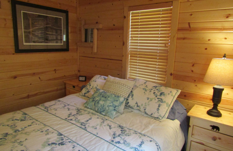 Cabin bedroom at Northwoods Vacation Rentals.