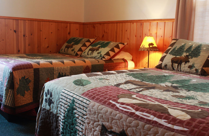 Cabin bedroom at Auger's Pine View Resort.