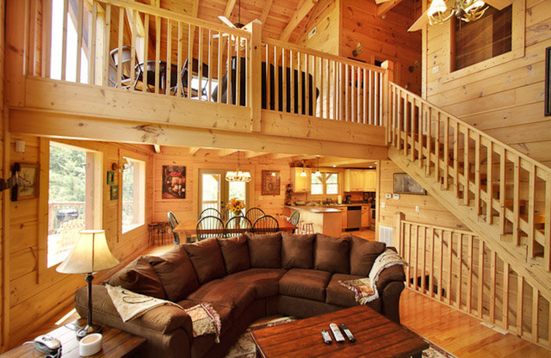 Rental living room and banister at Stony Brook Cabins, LLC.