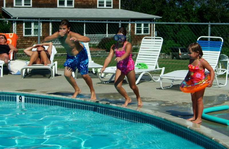 Kids jumping in pool at Mariner Resort.