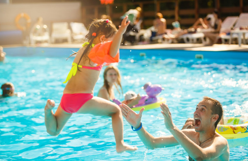 Family in pool at The Woodlands.