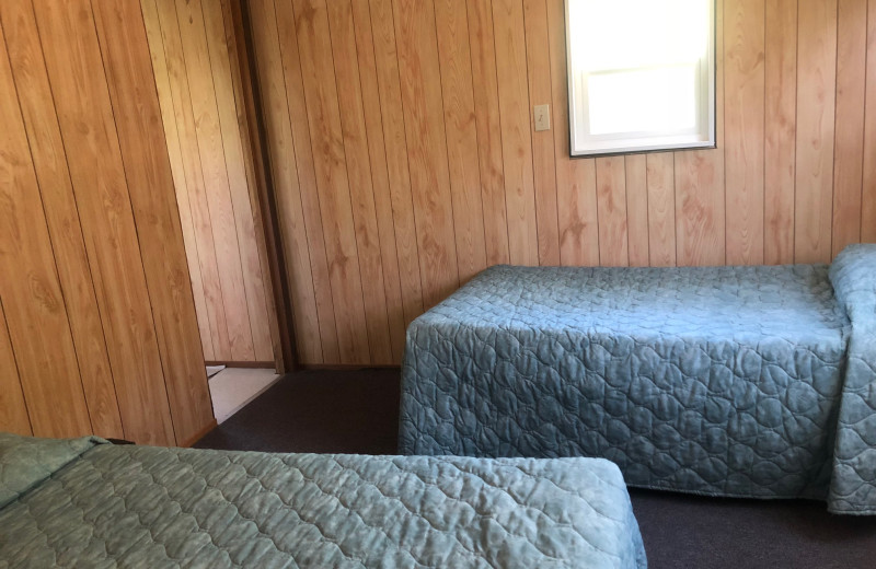 Cabin bedroom at Dogtooth Lake Resort.