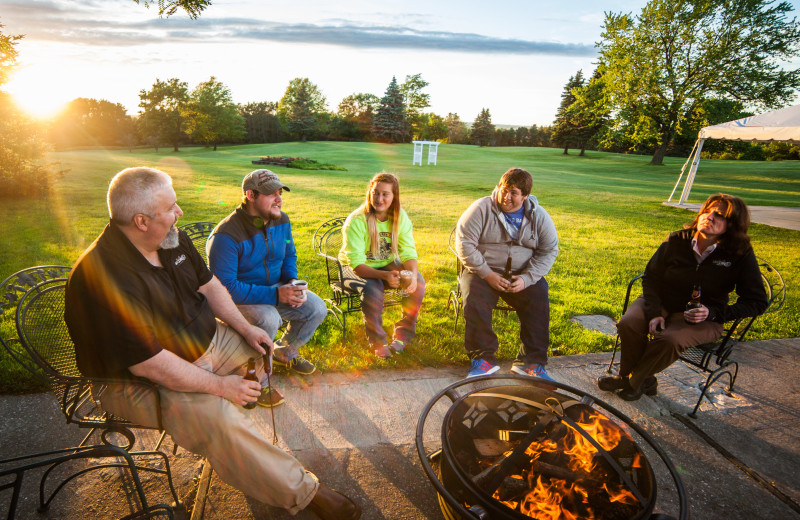 Relaxing by the fire at Evergreen Resort.