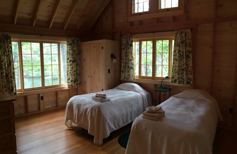 Cabin bedroom at Rockywold-Deephaven Camps.