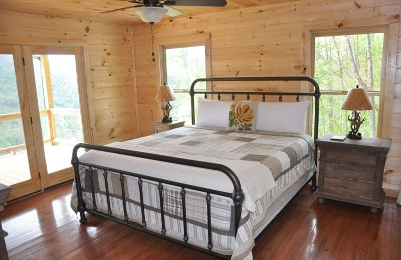 Cabin bedroom at Great Smokys Cabin Rentals.