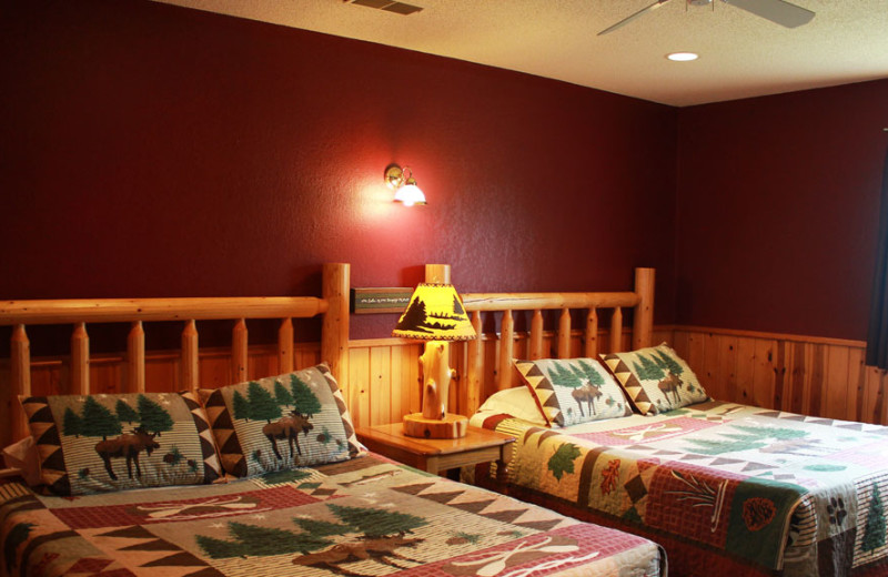 Cabin bedroom at Auger's Pine View Resort.