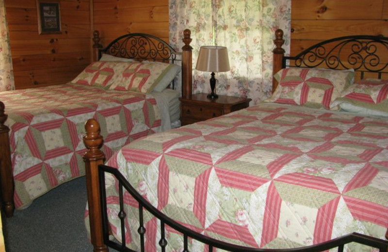 Cabin bedroom at Sunrise Log Cabins.