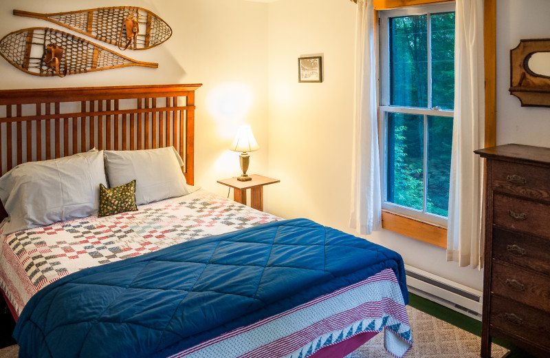 Cabin bedroom at White Pine Camp.