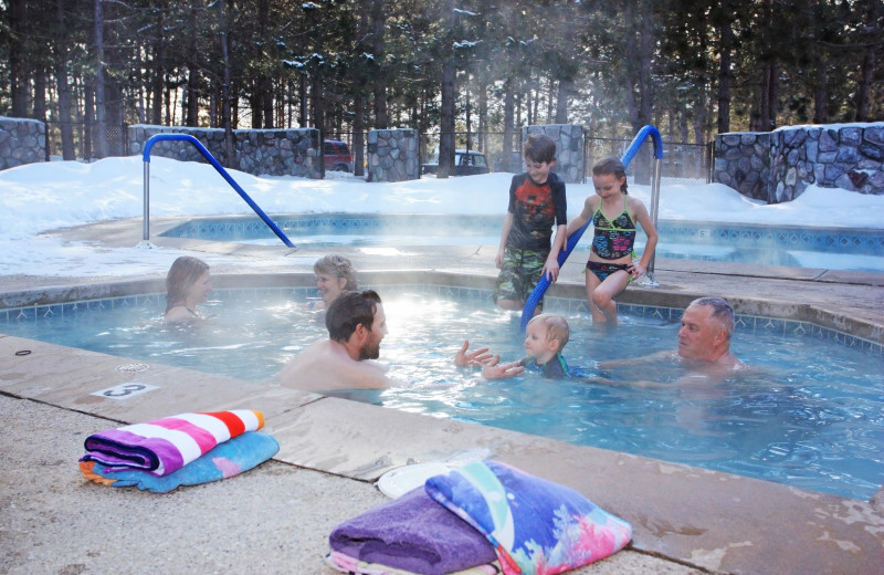 Family in hot tub at Trout Creek Condominium Resort.