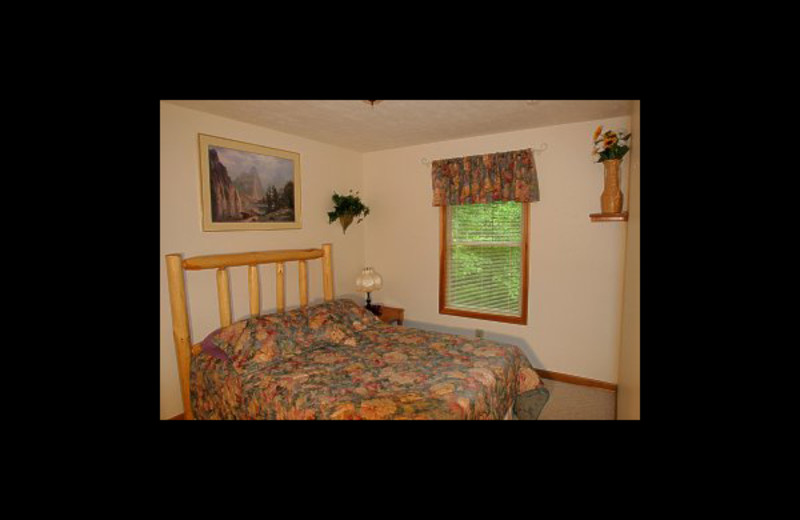 Cabin bedroom at Hummingbird Hill Cabin Rentals.