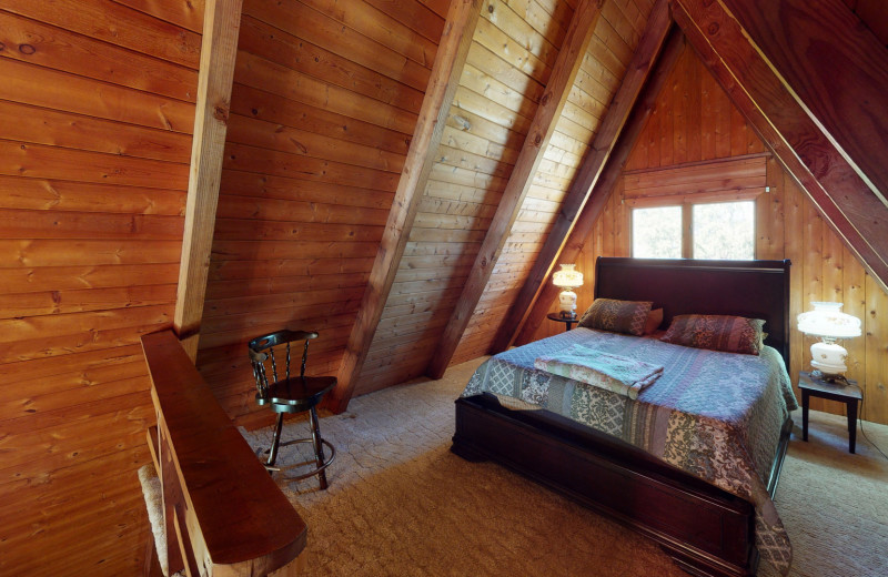 Cabin bedroom at 1st Choice Cabin Rentals.