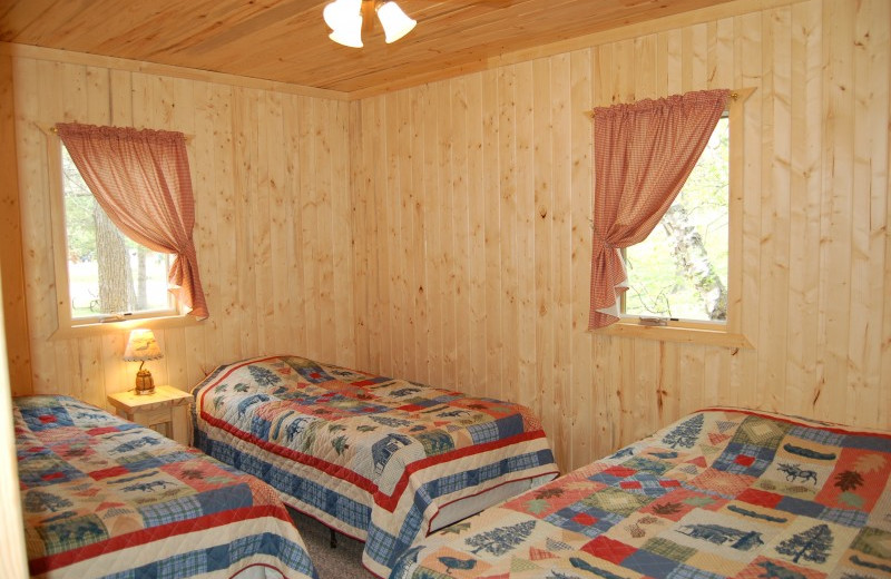 Cabin bedroom at Bear Paw Resort.