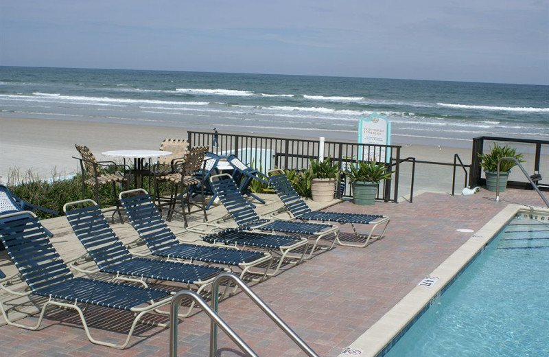 Poolside chairs at Daytona Shores Inn and Suites.