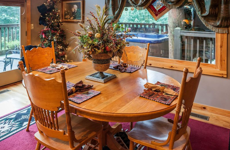 Cabin dining room at Mountain Oasis Cabin Rentals.