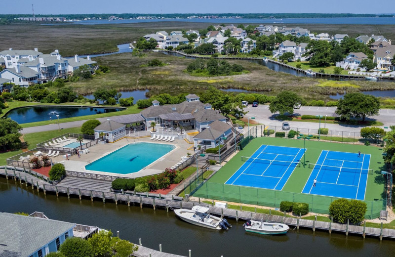 Rental pool and tennis court at Pirate's Cove Realty.