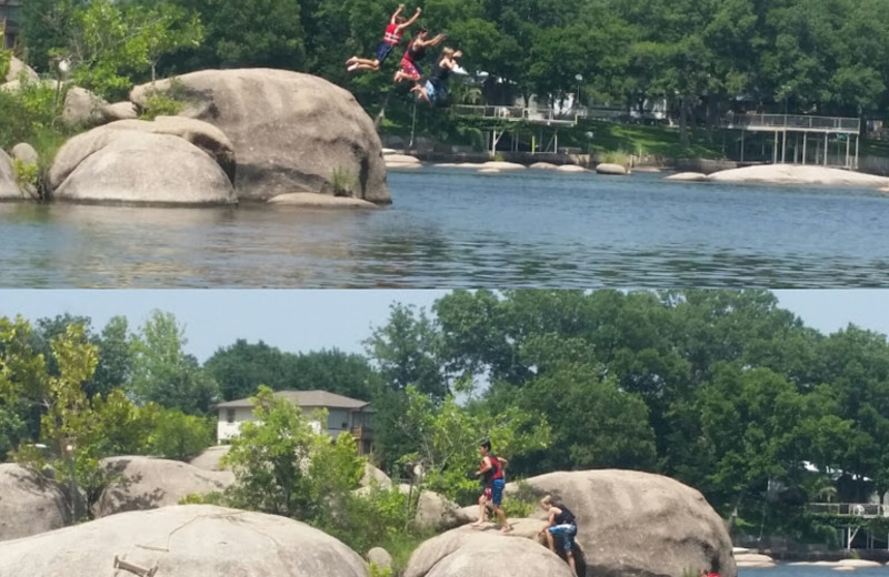 Family jumping into lake at Cool Water Cabin Rental - Lake LBJ.