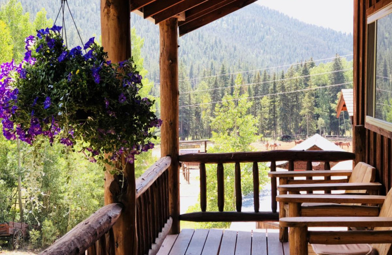 Cabin porch at Tumbling River Ranch.