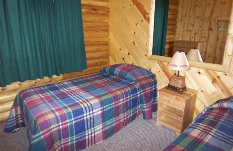 Cabin bedroom at Ash-Ka-Nam Resort.