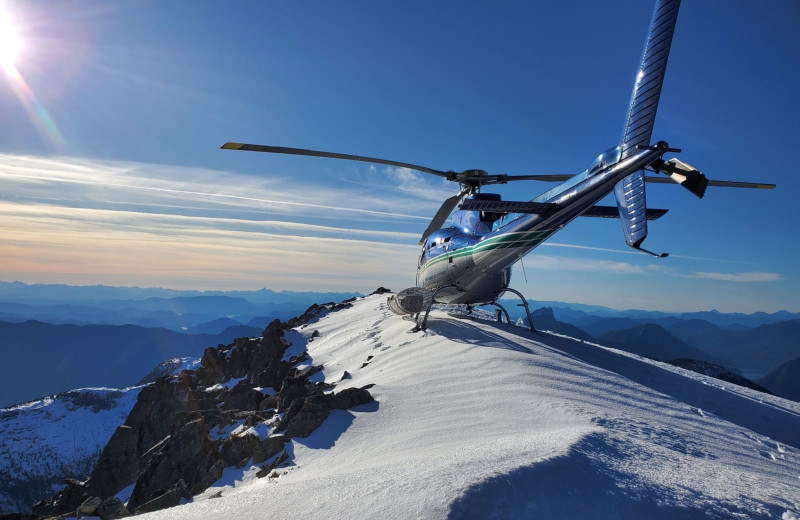 Helicopter over mountain at Nootka Wilderness Lodge.