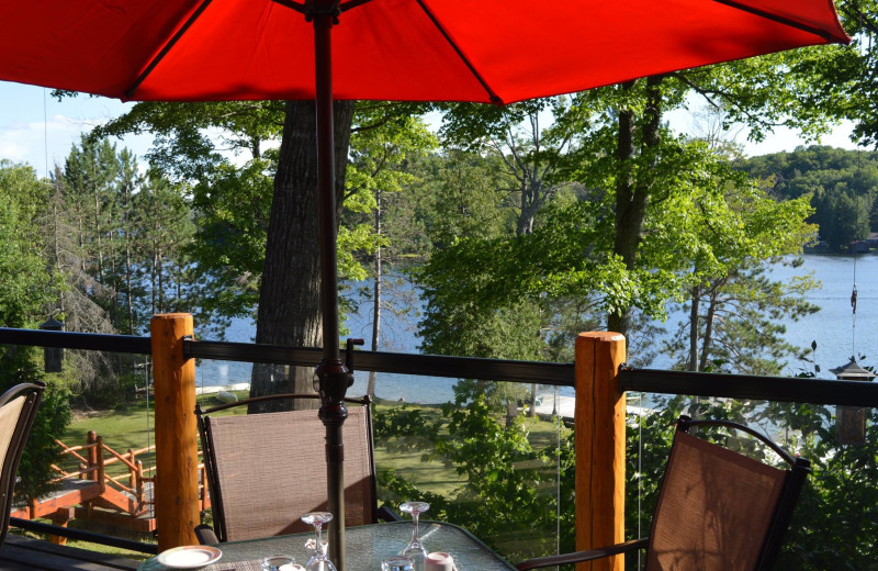 Beautiful view overlooking the lake on the patio while you dine at Heather Lodge.  Be sure to watch for the flying squirrels just after sunset.