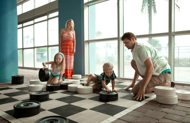 Family playing checkers at Bay View Resort.