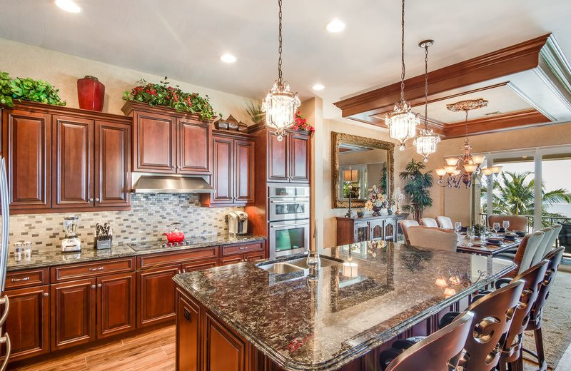 Rental kitchen at Sun Palace Vacation Rentals.