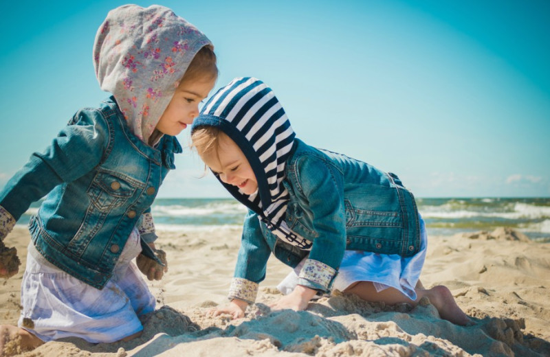 Kids playing on beach at Inn at the Pier.