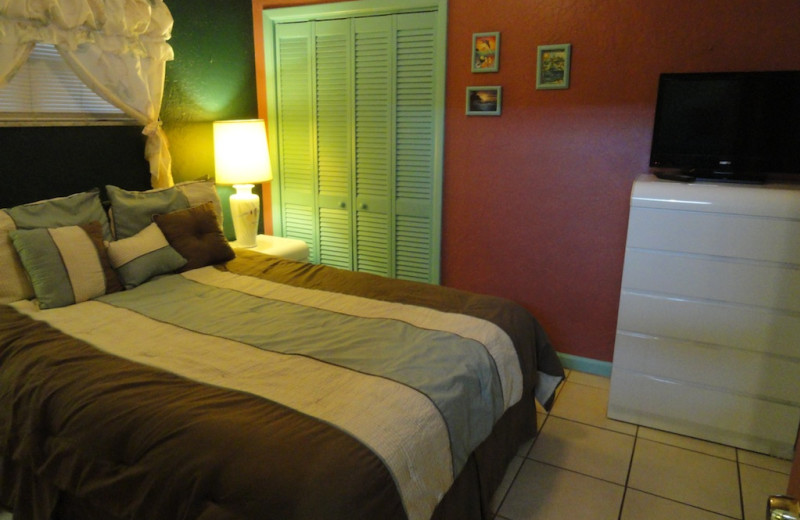 Cottage bedroom at Whispers Resort.