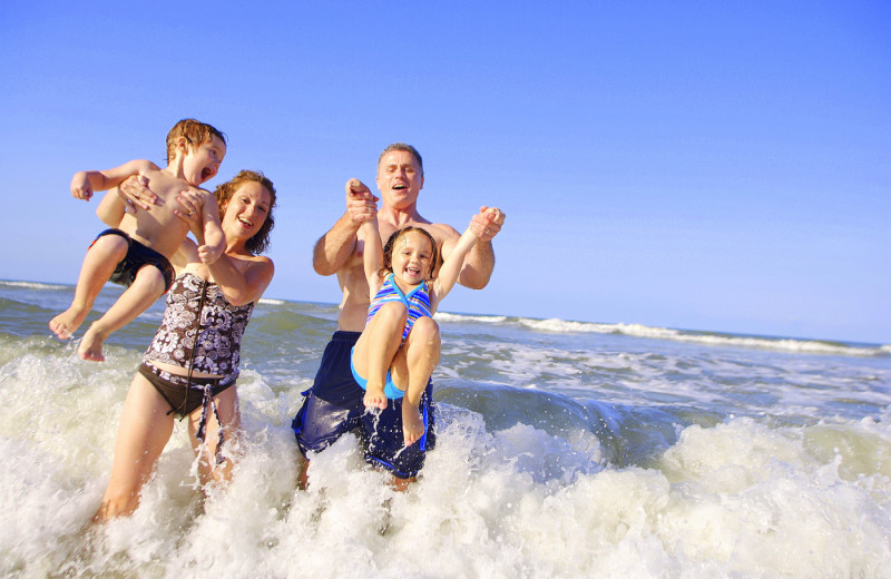 Family on the beach at Islander Hotel & Resort.