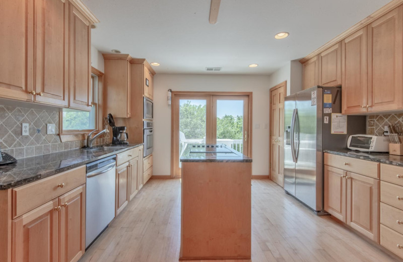 Rental kitchen at Joe Lamb Jr. & Associates Vacation Rentals.