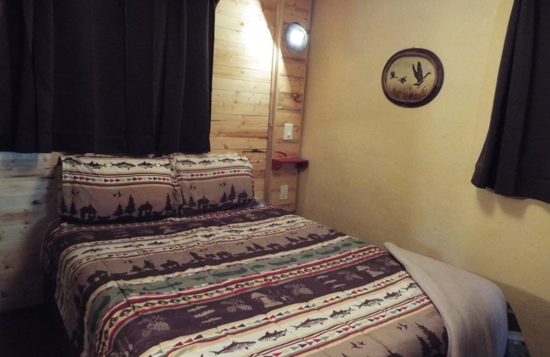 Cabin bedroom at Rustic River Cabins.