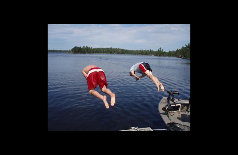Jumping in lake at Stokes Bay Resort.