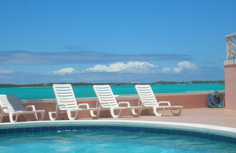 Relax by the pool at Club Peace and Plenty.