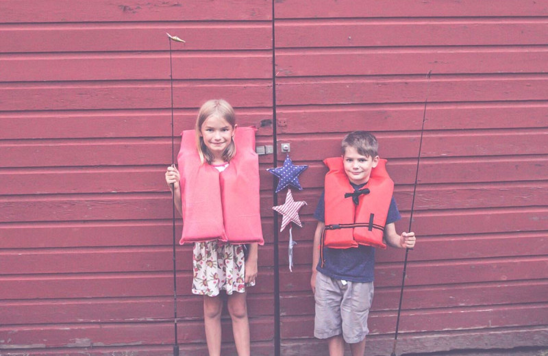 Kids with fishing poles at The Hideaway at Xanadu Island.