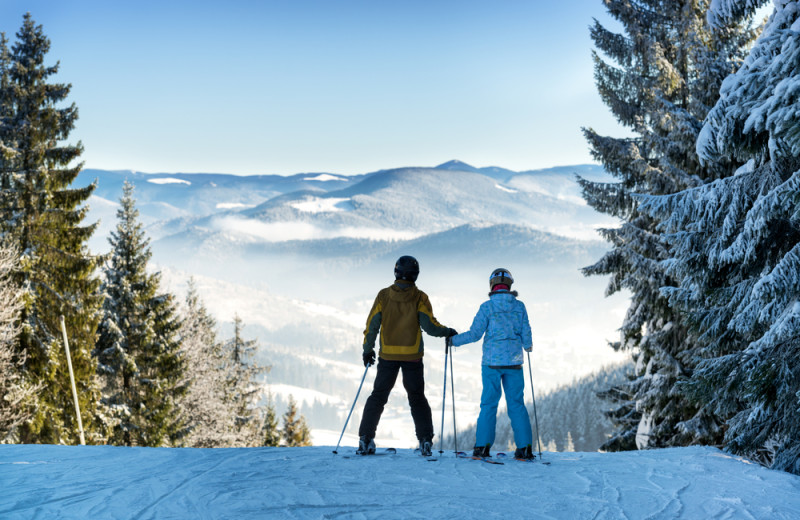 Couple skiing at Lion Square Lodge.