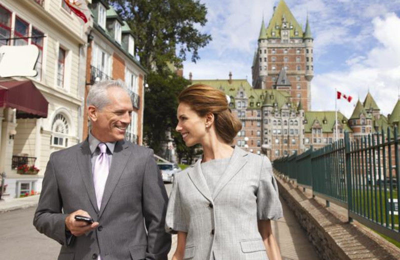 Couple walking near Fairmont Le Chateau Frontenac.