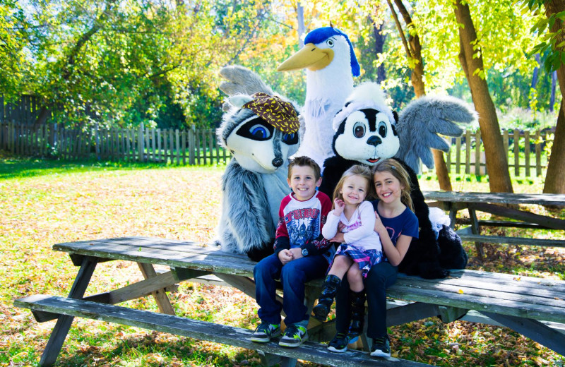 Family and mascots at Vine Ridge Resort.
