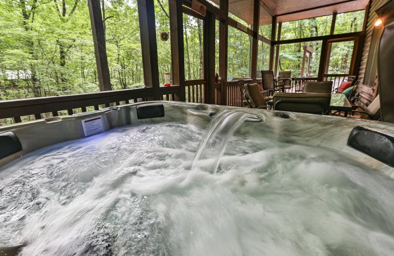 Cabin hot tub at Mountain Oasis Cabin Rentals.