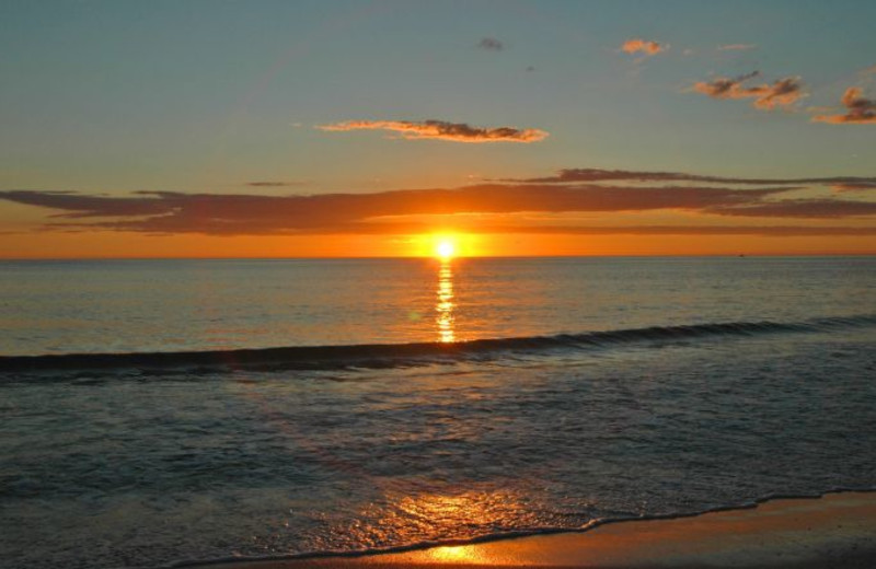 Sunset on the beach at Anna Maria Vacations.