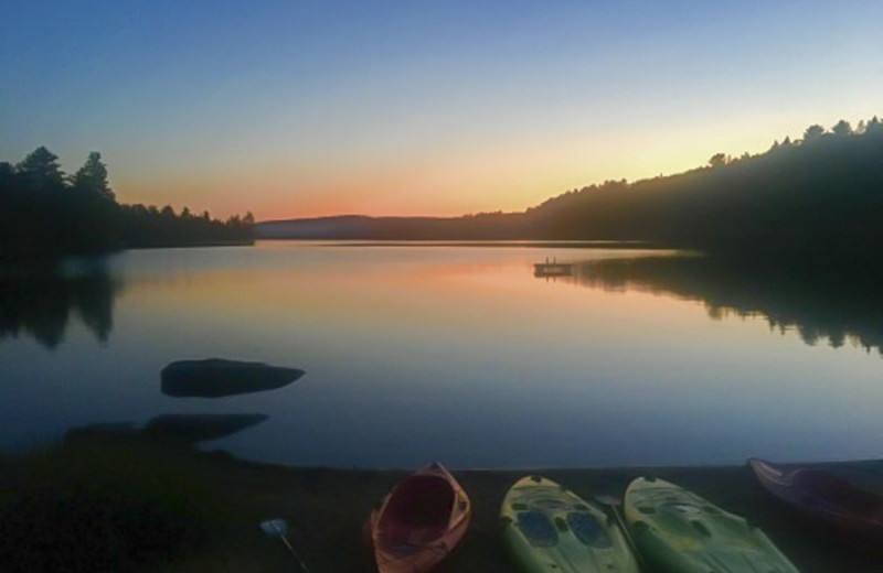 The beach of Killarney Lodge just after sunset on a summer evening.