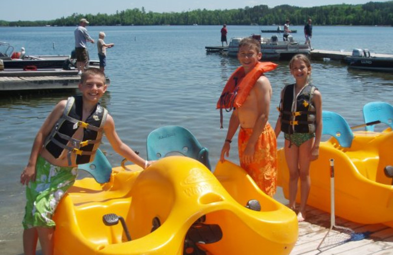 Kids using paddle boats at Thunder Lake Lodge.  