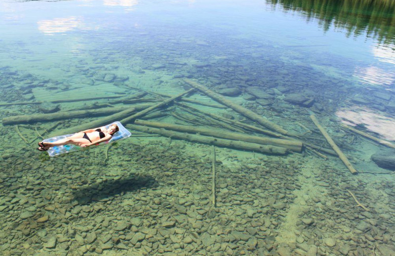 Relaxing in lake at Many Springs Flathead Lake Resort.