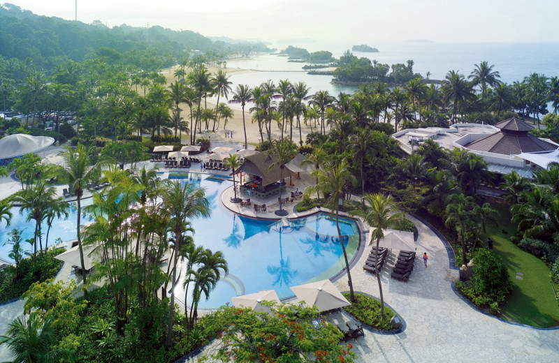 Outdoor pool and beach at Shangri-La's Rasa Sentosa Resort-Singapore.