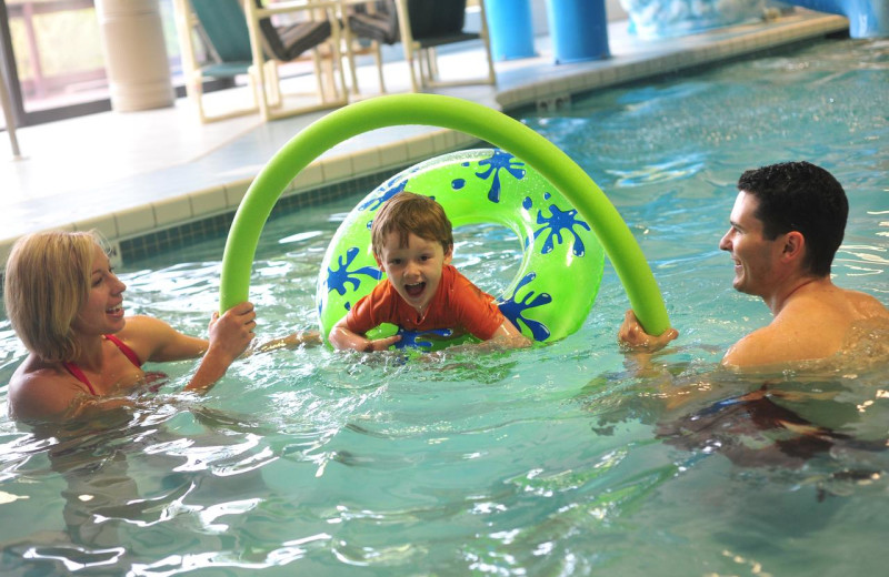 Family in indoor pool at Baker's Sunset Bay Resort.