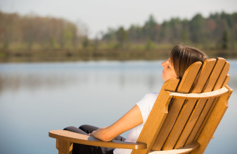 Relaxing by lake at The Lodge at Woodloch.
