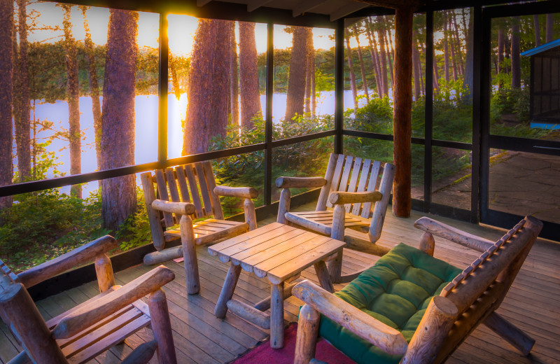 Cabin porch at White Pine Camp.