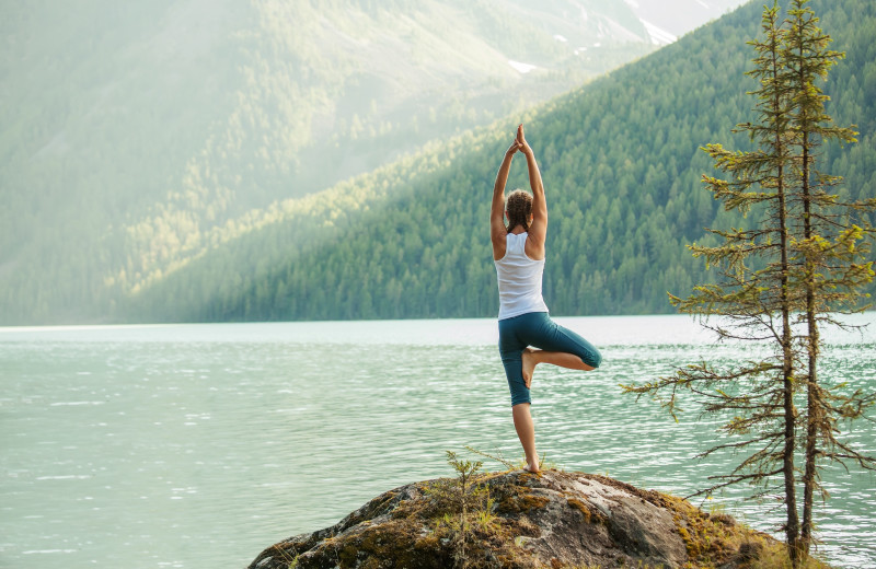 Yoga by lake at Harrison Beach Hotel.