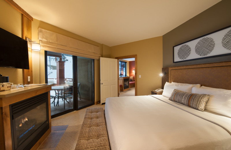 Guest bedroom with fireplace at Grand Summit.