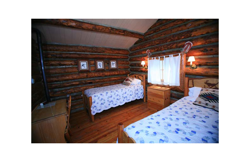 Cabin bedroom at Rimrock Dude Ranch.